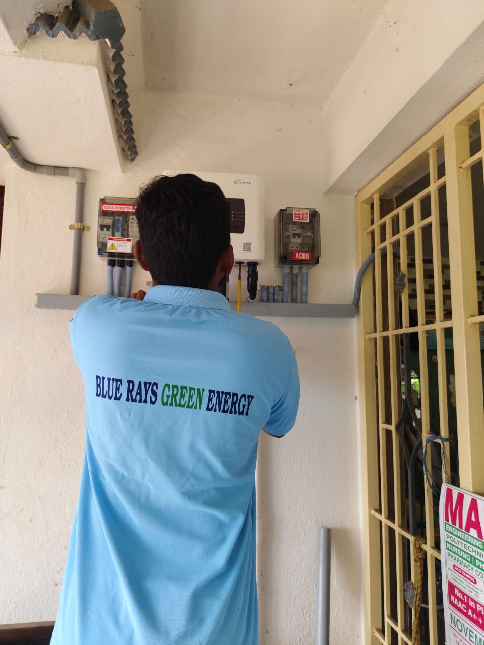 Blue Rays Green Energy Technician Installing Solar System